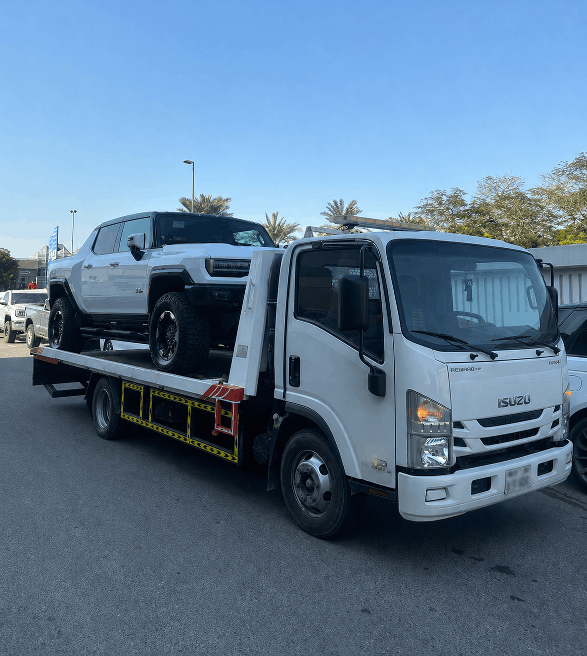 Tow truck loading a rugged SUV